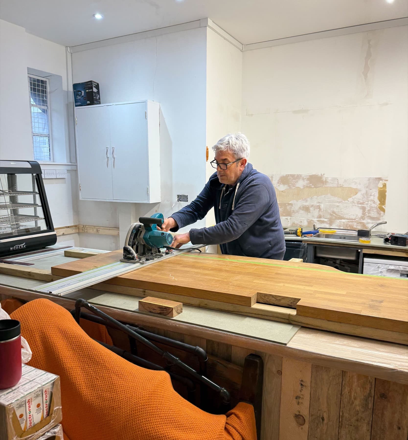 Handyman carrying out maintenance work inside a property